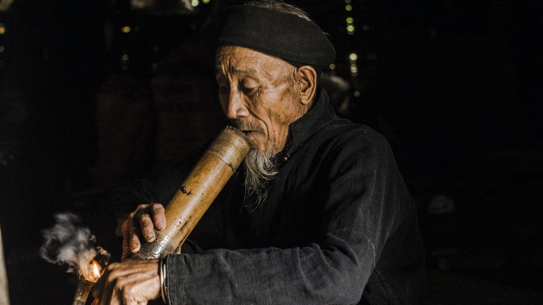 Man smoking bamboo bong - Shell Shock