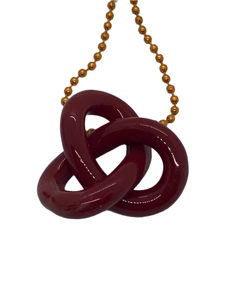 Infinity knot endant by Natey Biskind - Shell Shock