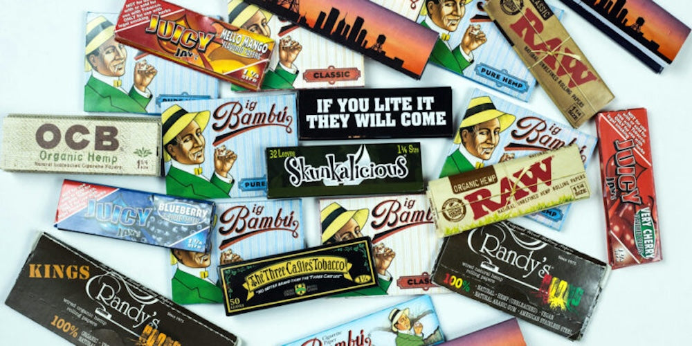 variety of cannabis rolling papers on white backround