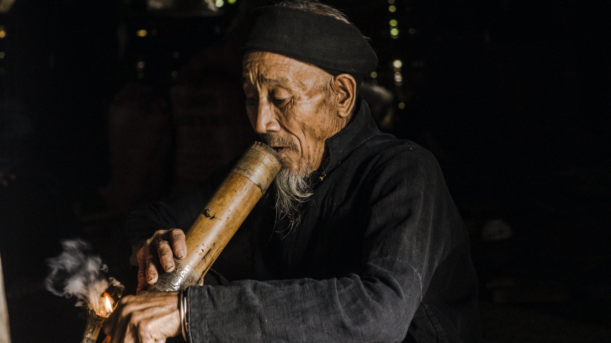 Man smoking bamboo bong - Shell Shock 
