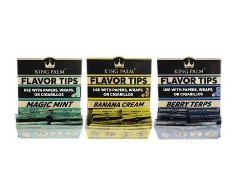 Three packages of King Palm Flavor Tips with different flavors on a white background
