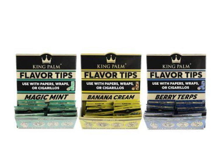 Three packages of King Palm Flavor Tips with different flavors on a white background