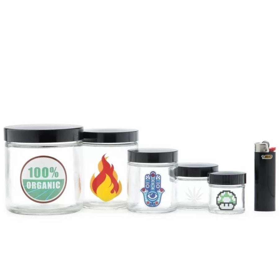Set of glass jars with various designs and a lighter on a white background