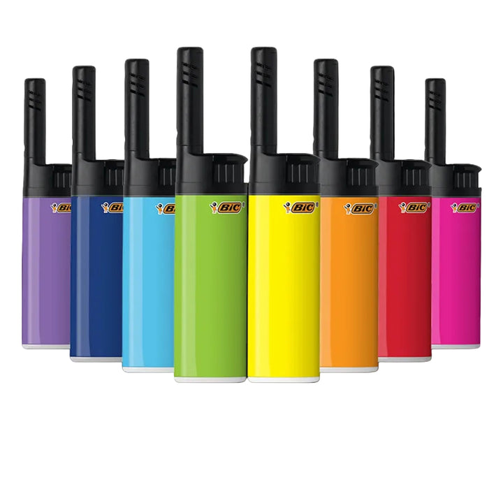 Set of colorful BIC lighters arranged in a row on a white background