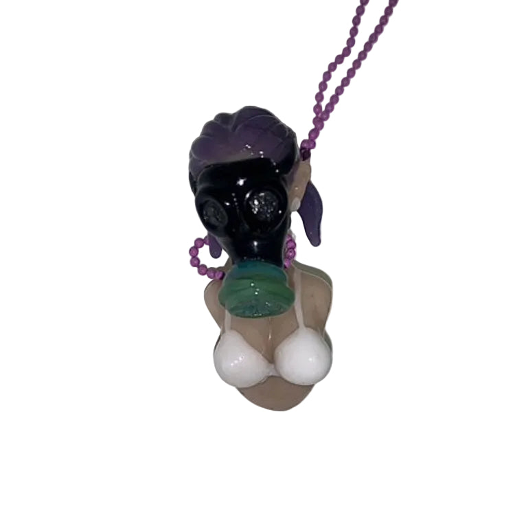 glass pendant of a woman with purple hair with a white background