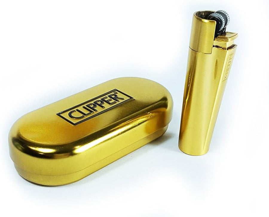 a small golden clipper lighter on a white background