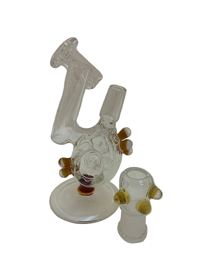 Clear glass smoking device with brown accents on a white background
