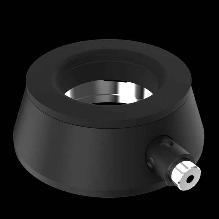 A small black and metal connector piece on a white background