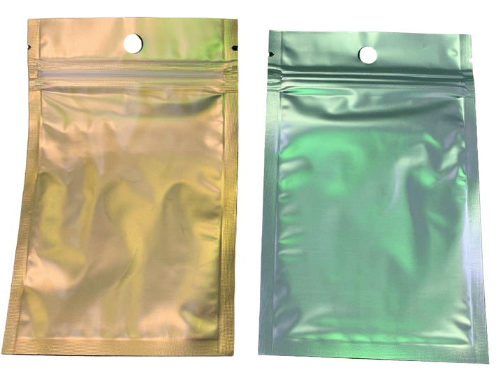 Two metallic gold and green pouches with zipper closures on a white background