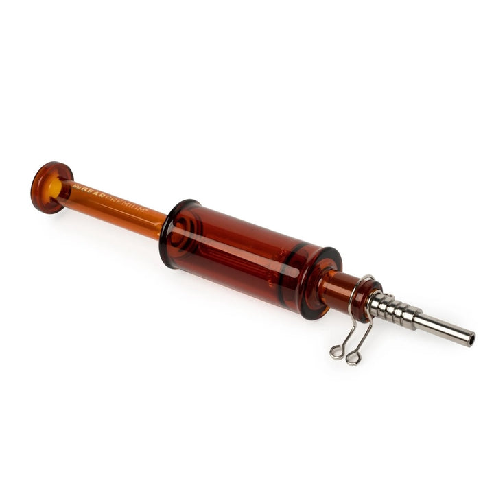 Brown glass dabmolisher with metal tip on a white background