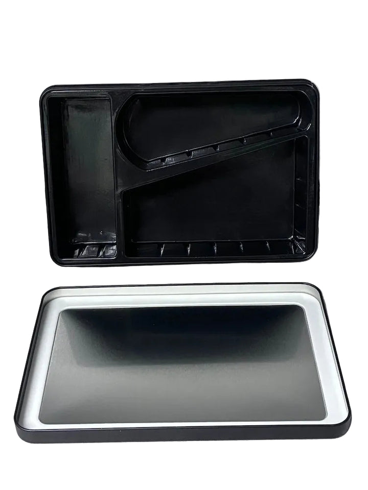 Two black plastic trays on a white surface