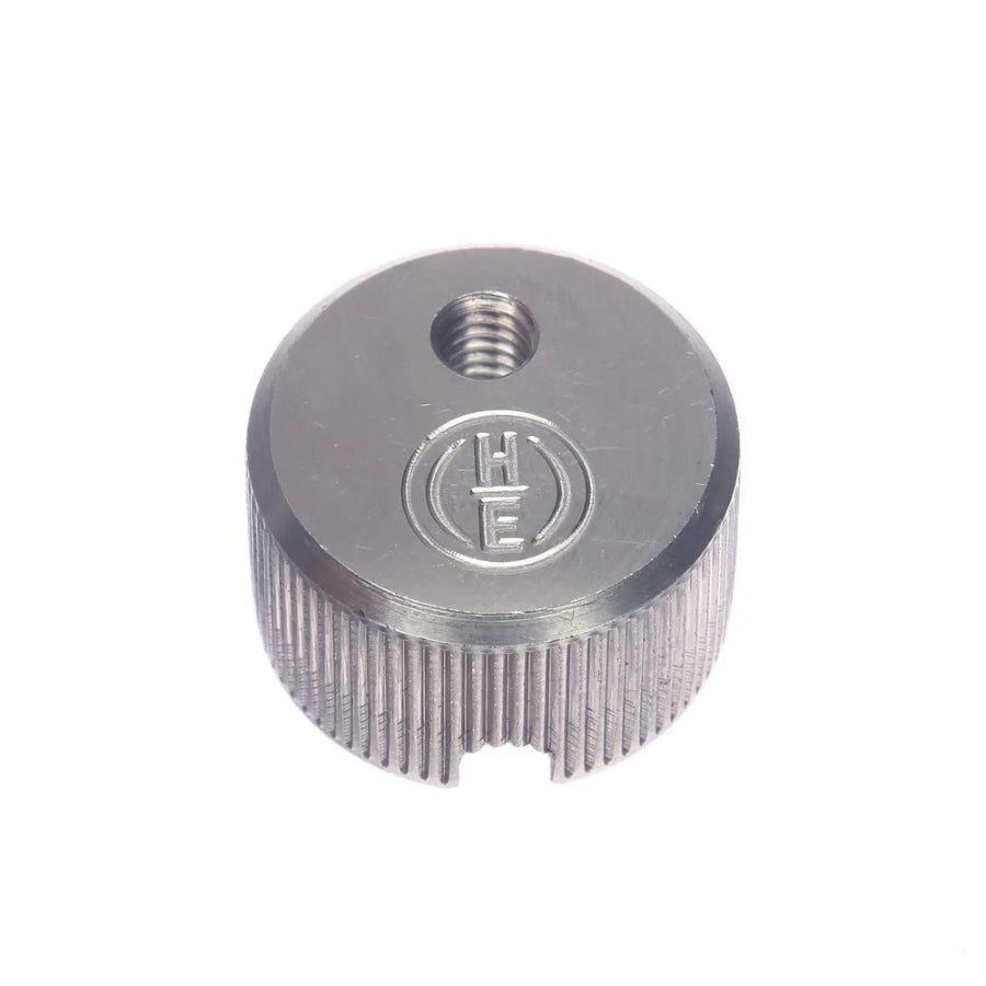 a small silver metallic cap on a white background