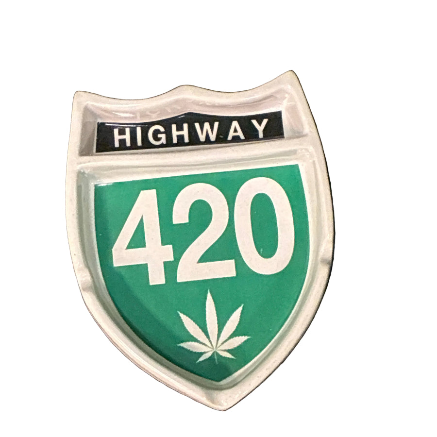 ceramic ashtray with highway 420 and a weed leaf on a white background