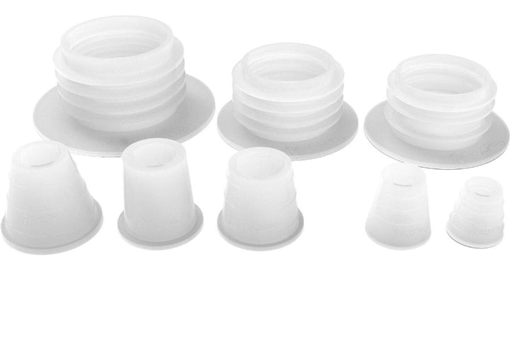 Set of white silicone cupping devices on a white background