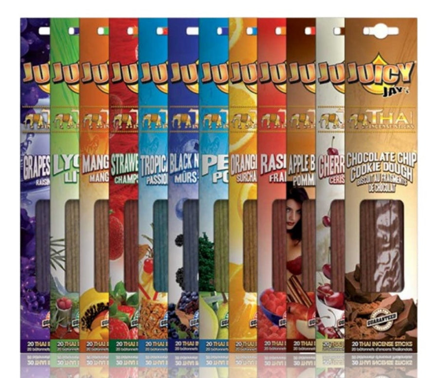 Assorted flavours of Juicy Jay's rolling paper packages on a white background