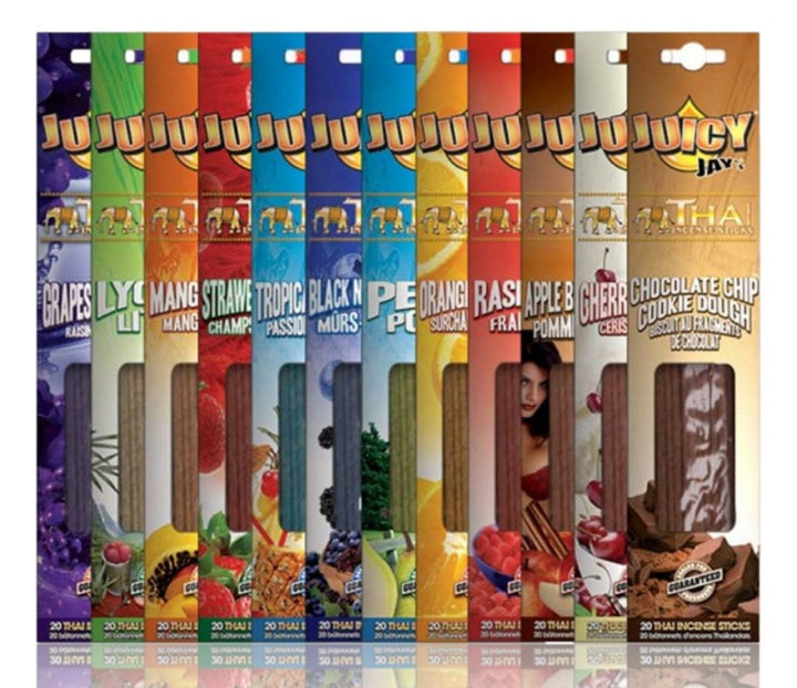 Assorted flavours of Juicy Jay's rolling paper packages on a white background