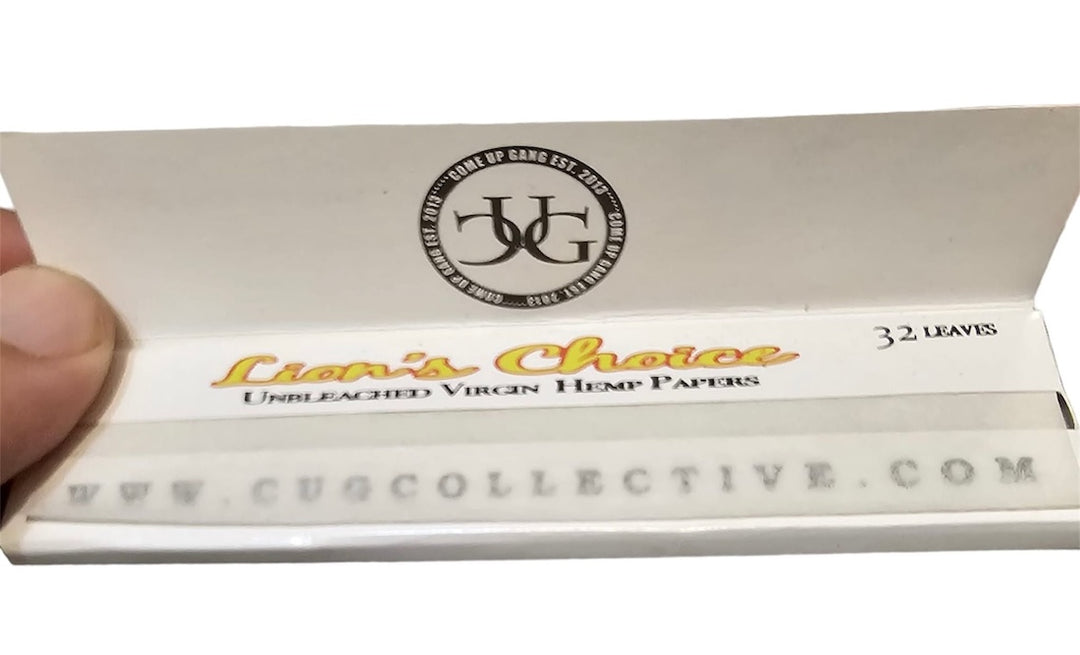 Cigarette rolling paper pack with 'Lion's Choice' branding and a visible hand holding it.
