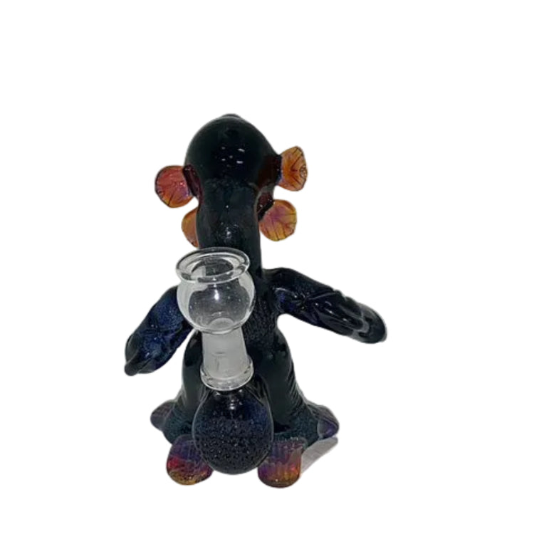 Black and purple glass figure with a small glass container on a white background