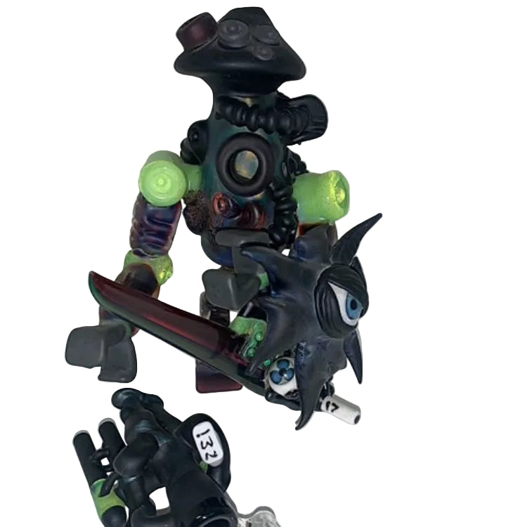 Toy figure with black and green details on a white background