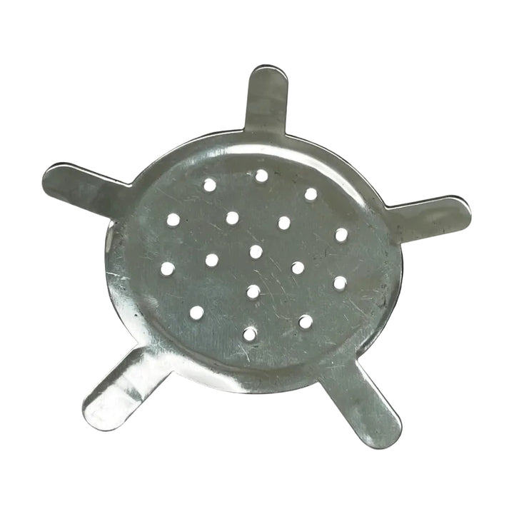 A small metal piece with holes in it on a white background