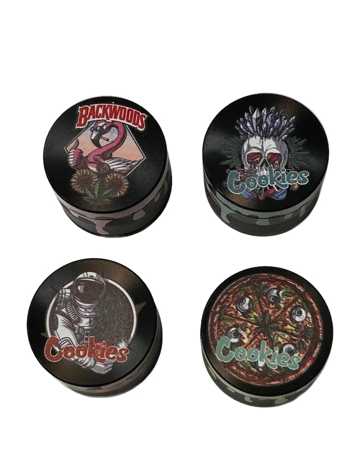 Metal Grinder 4 Piece with assorted designs on white backround