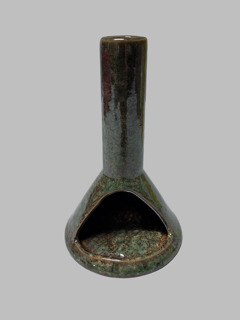 Ceramic vase with a textured surface on a white background