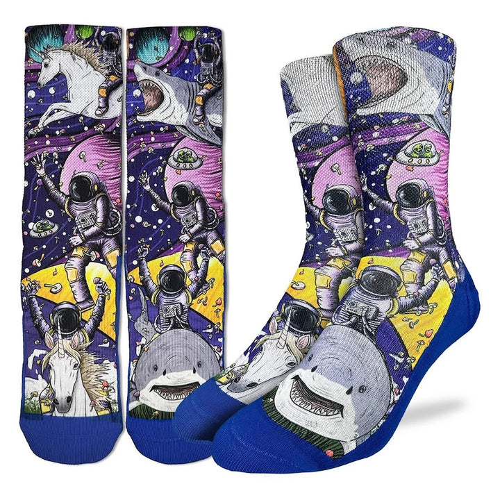 Colorful socks with space-themed designs featuring astronauts, sharks, and unicorns on a white background.