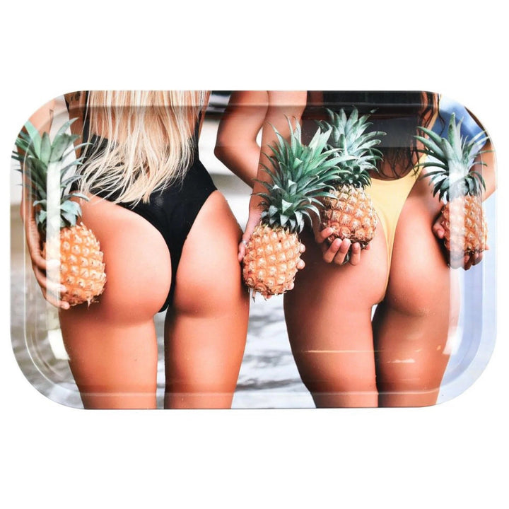 a rolling tray with two women holding pineapples with a focus on their butts, on a white background.