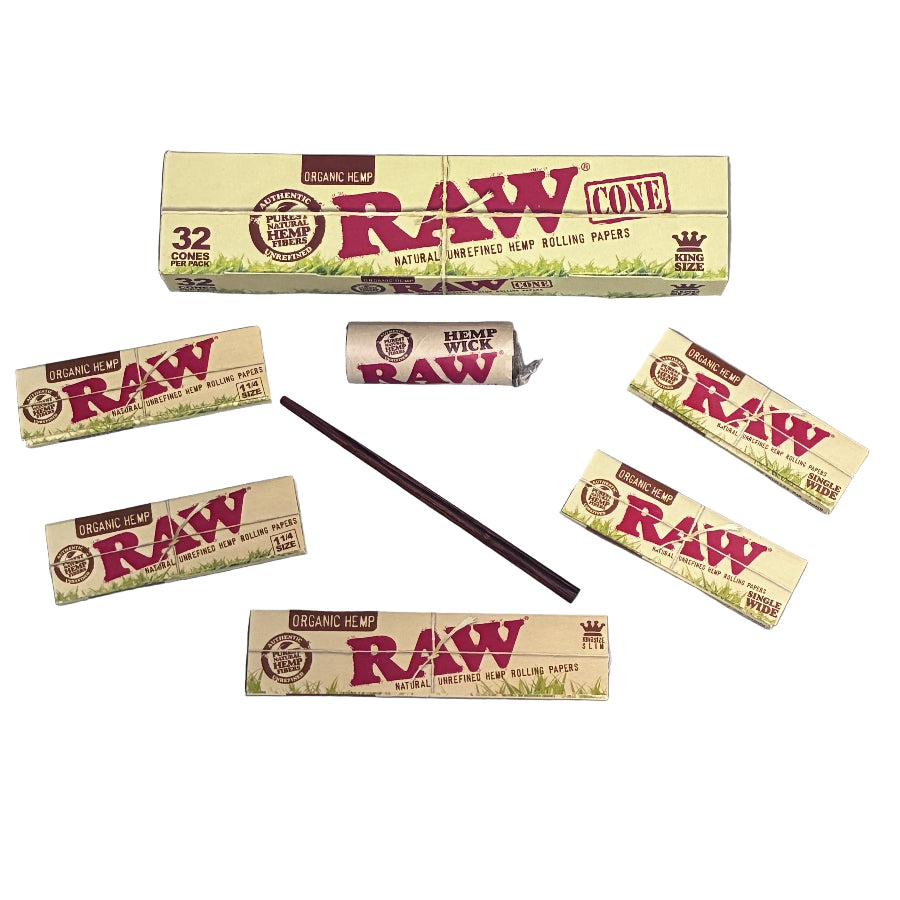 Raw rolling papers, hemp wick, poker, and cones on a white background