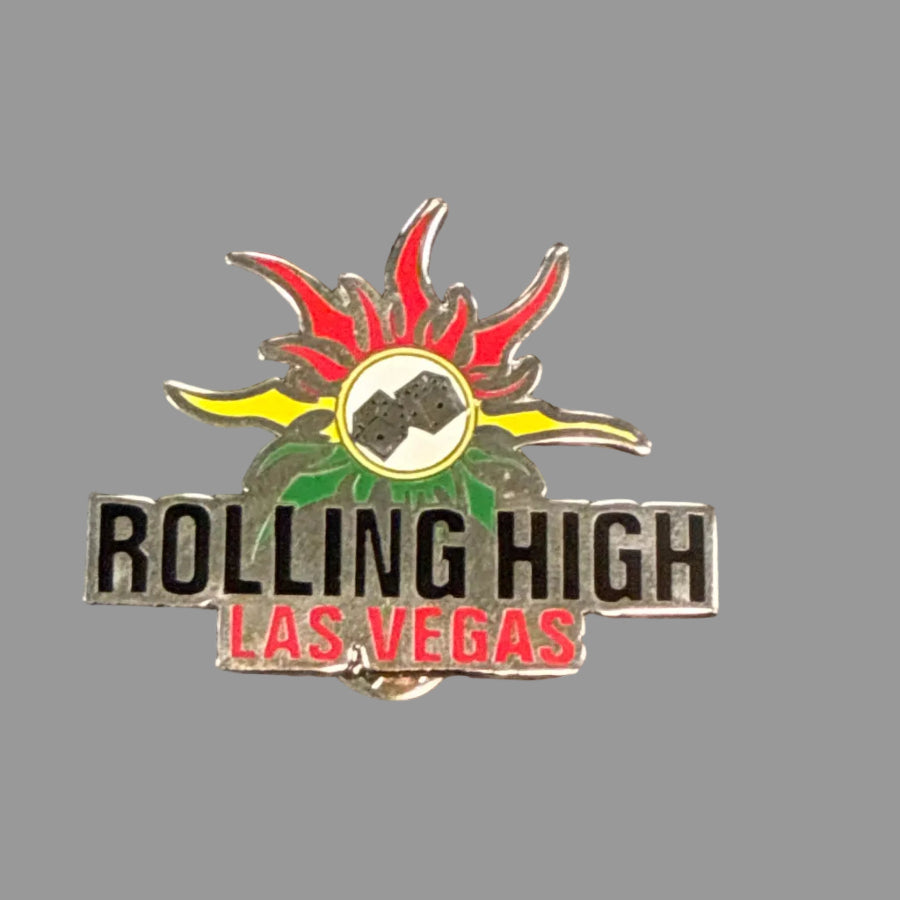 Metal hat pin with "Rolling High Las Vegas" on grey background