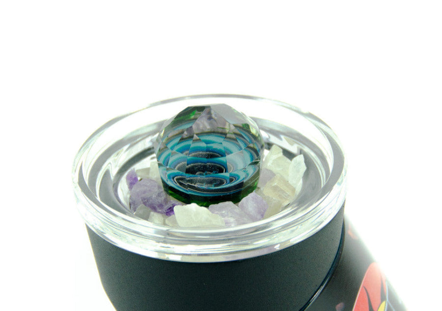Glass smoking accessory with colorful interior on a white background
