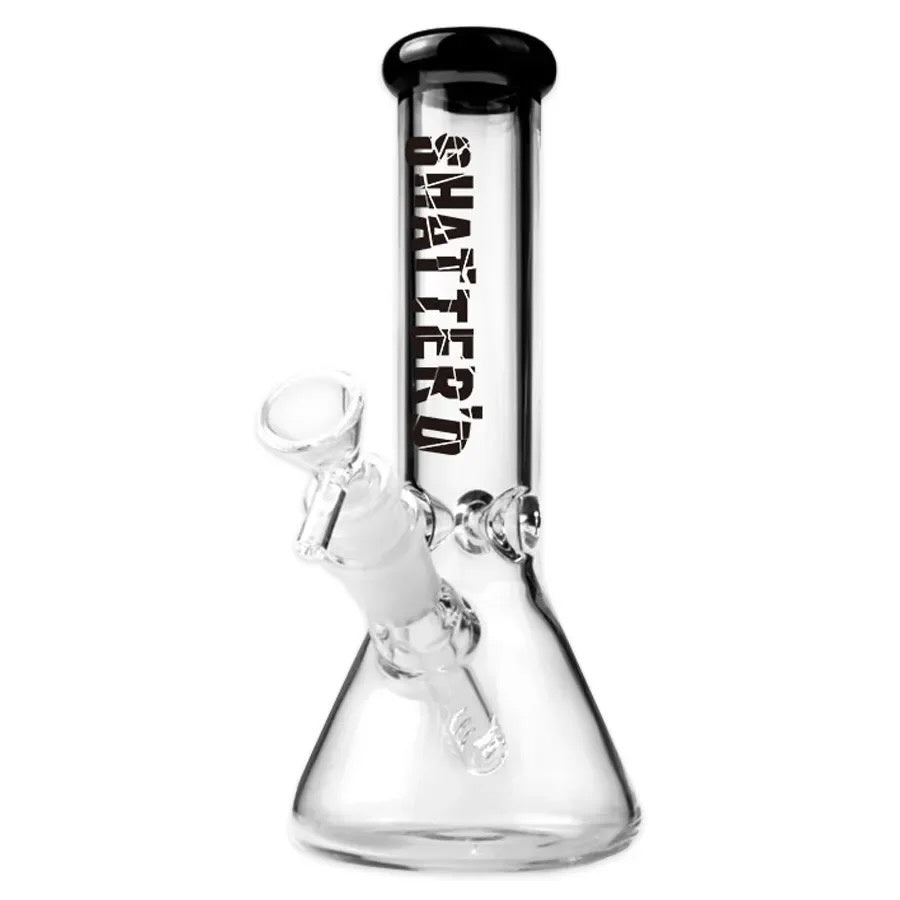 Clear glass smoking device with black top and 'Shatter'd text on a white background