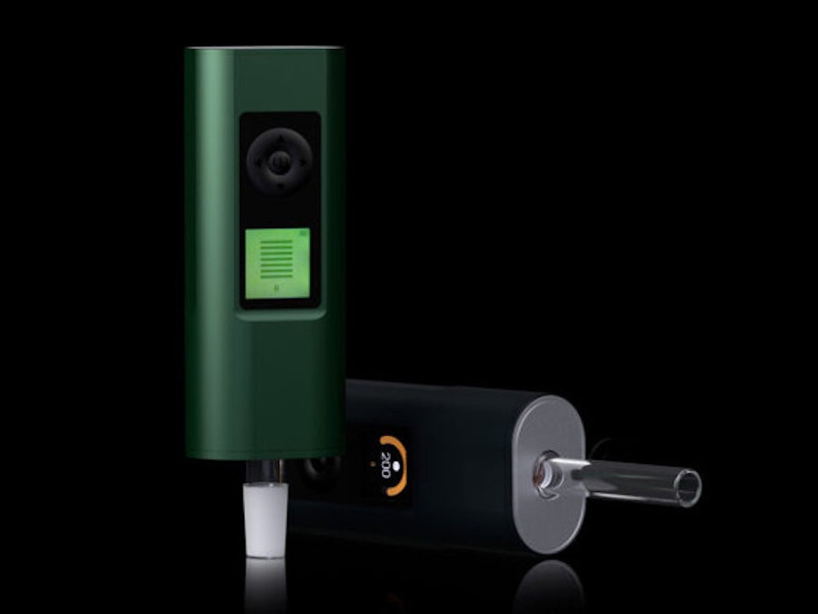 Green electronic device with a screen and a cylindrical component on a black background