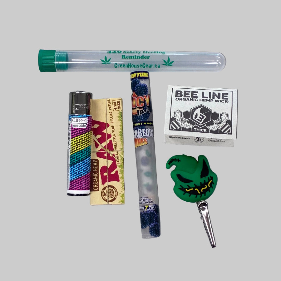 Collection of smoking accessories on a gray background