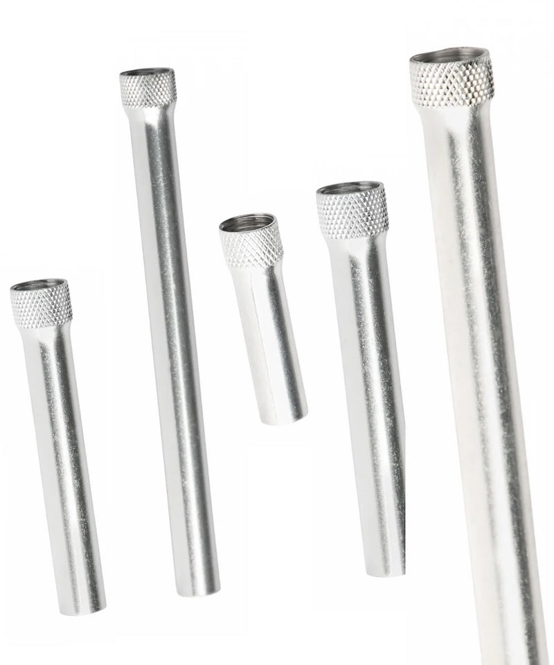 Set of five metallic tubes with textured ends on a white background