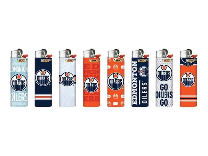 edmonton oilers bic lighters in a row on white backround
