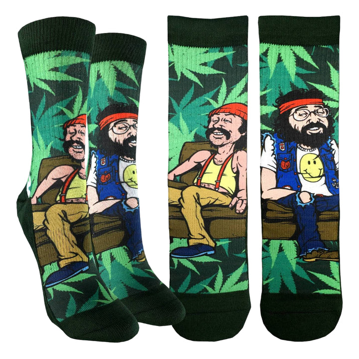 Four socks with a cartoon character sitting on a couch against a leafy green background.