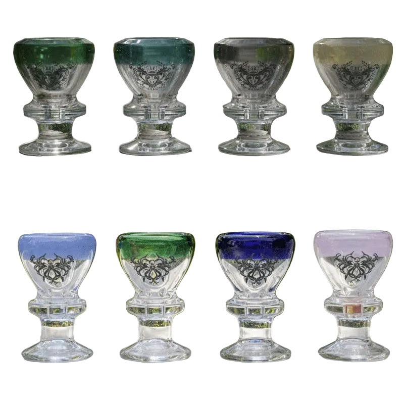 Set of six glass goblets with colored bottoms on a white background.