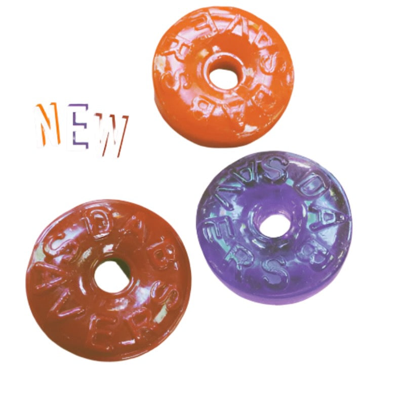 Three colorful donut-shaped glass carb caps with text on a white background