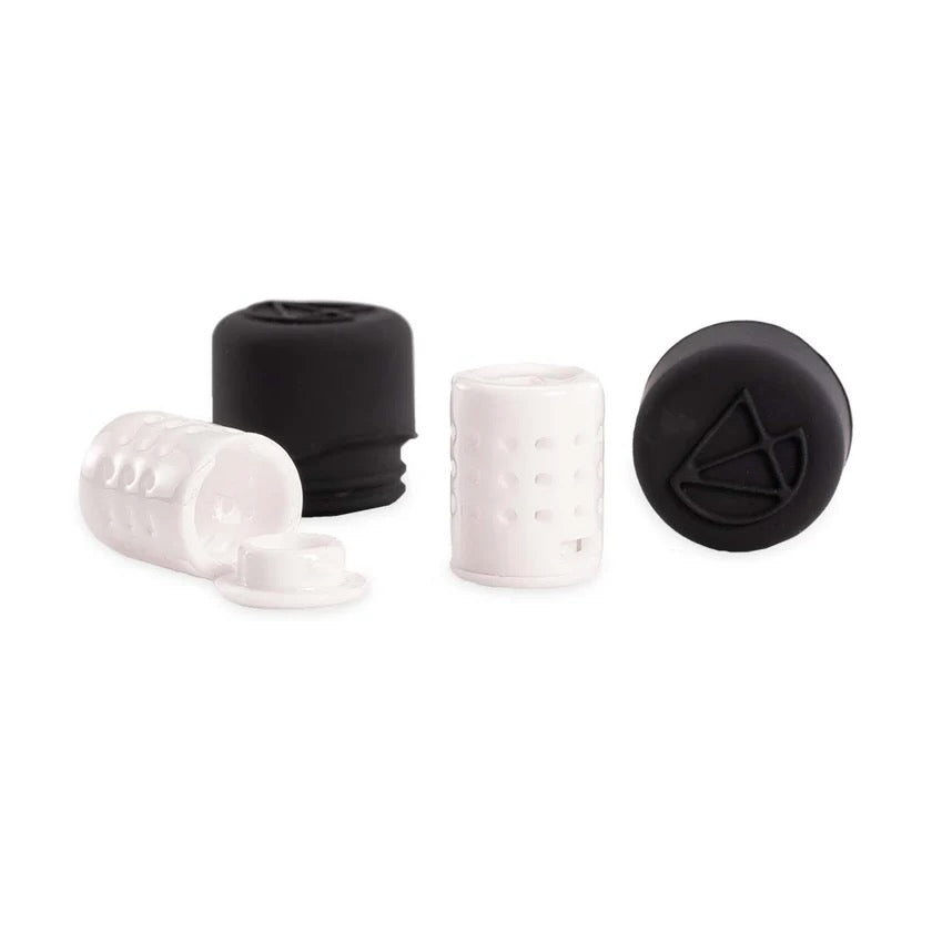 A couple plastic dosage pods on a white background