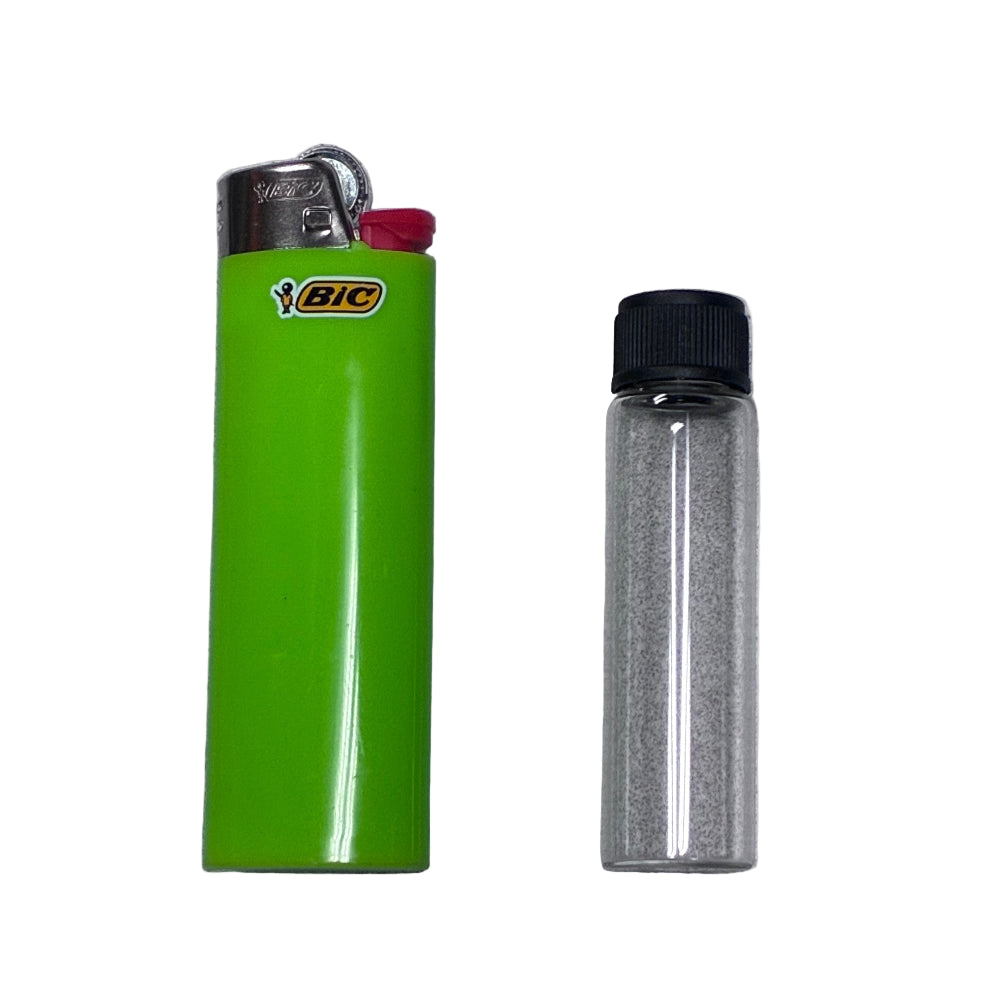 Green BIC lighter and a glass vial with black lid on a gray background