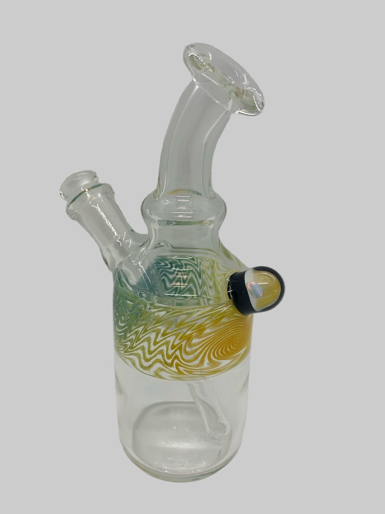 Clear glass water pipe with decorative base on a white background