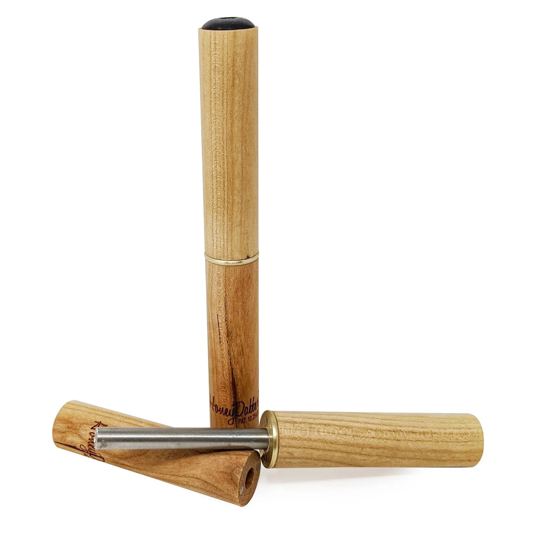 Wooden dabber with titanium tip on a white background