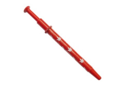 Red pen with white floral patterns on a white background