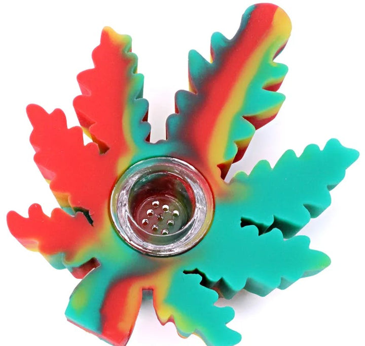 A six-pointed star-shaped silicone fidget spinner with a rainbow gradient of red, orange, yellow, green, and blue, featuring a clear glass bowl in the center, shown on a white background.