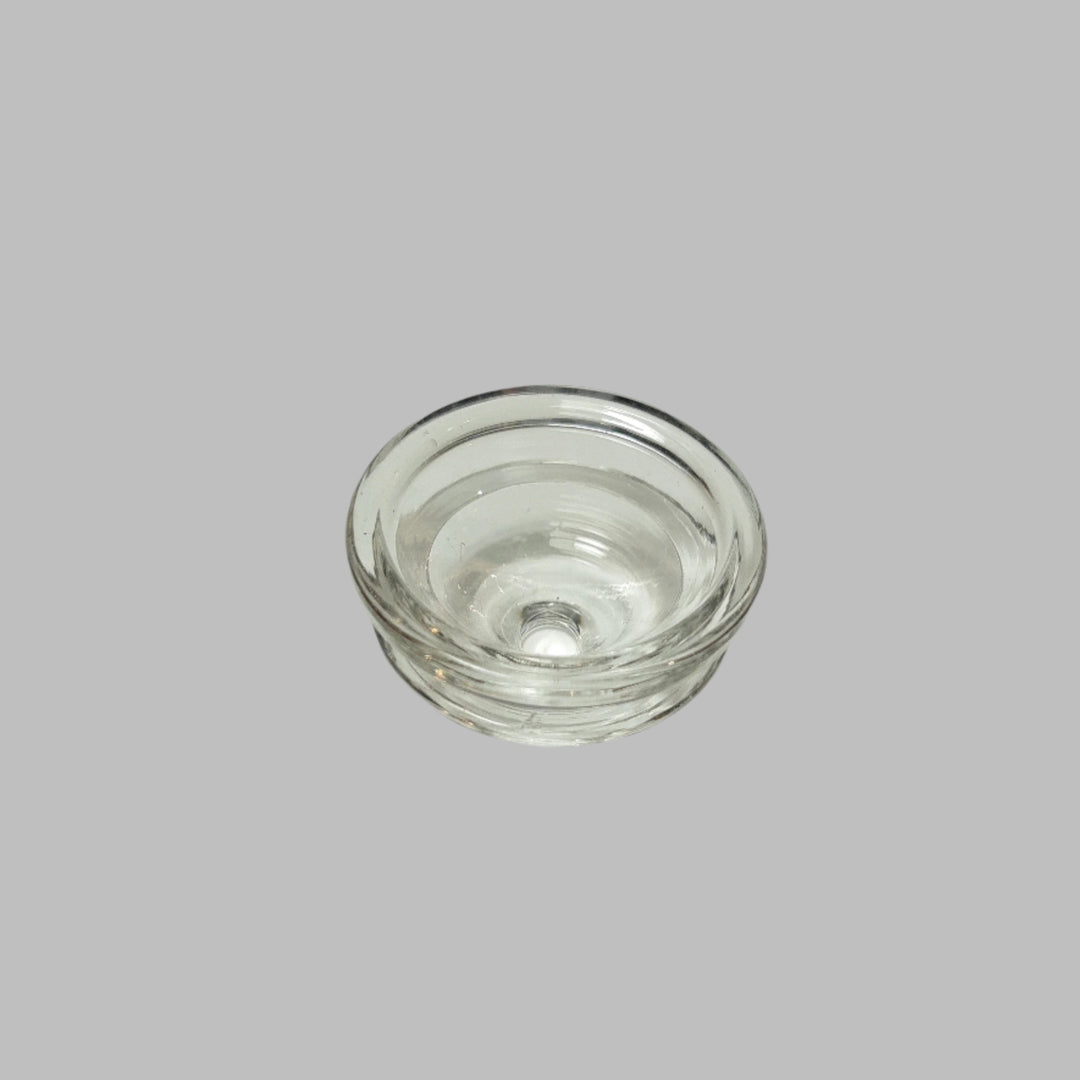 Clear glass bowl on a gray background