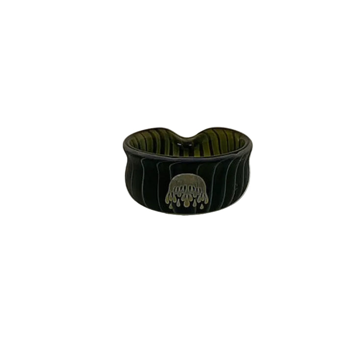 Black ceramic bowl with a textured surface on a white background