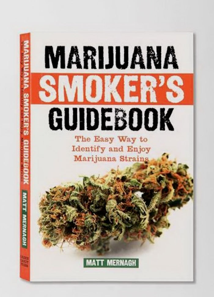 Book titled 'Marijuana Smoker's Guidebook' with a cannabis bud on a white background