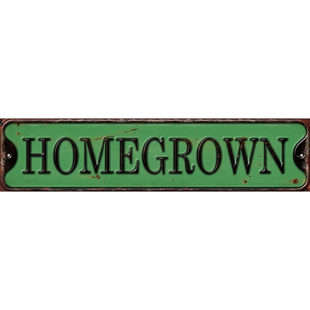 Green metal sign with 'HOMEGROWN' text on a white background - shell shock