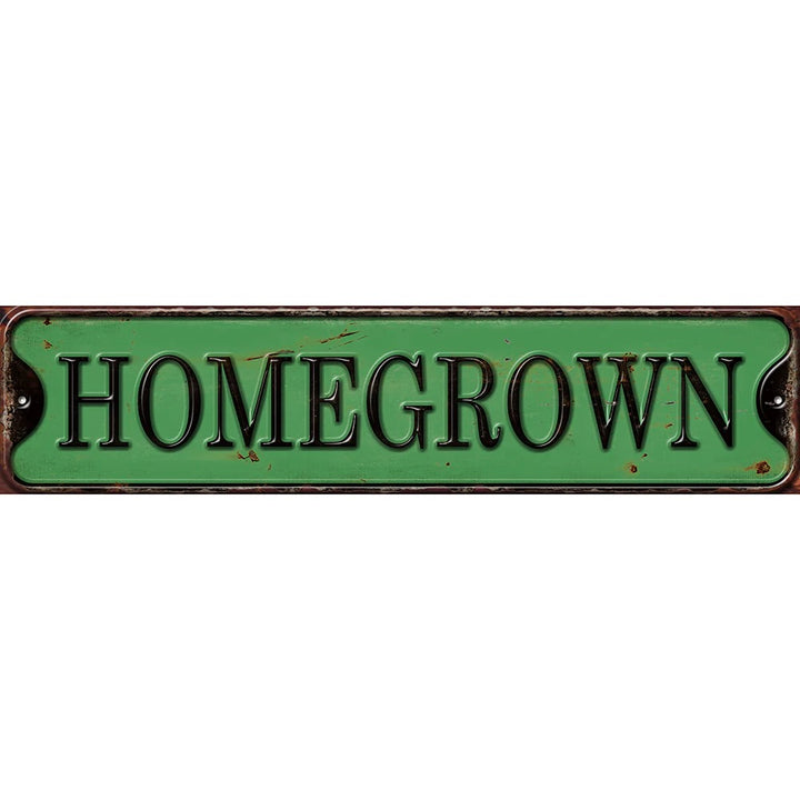 Green metal sign with 'HOMEGROWN' text on a white background - shell shock